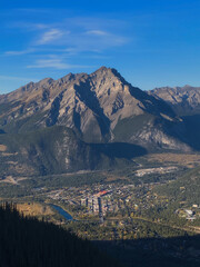 Aerial View of Mountain Town Beneath Majestic Peaks