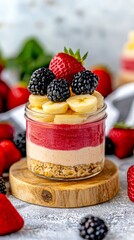 Delicious layered dessert in a jar with fruits, set against a blurred kitchen background