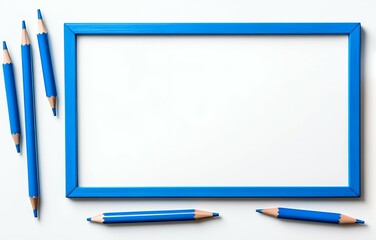Flat Lay of a Vibrant Blue Picture Frame and Various Blue Colored Pencils on a White Background