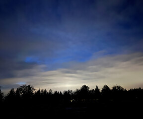 blue sky with clouds and rainbow