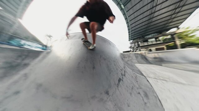 Skateboarder performing tricks in skatepark montage