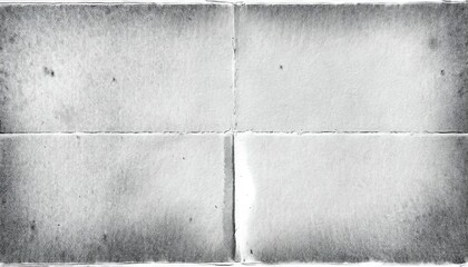 Obraz premium A textured, monochrome surface with a subtle grain, split into four quadrants, evoking a sense of vintage aesthetics.