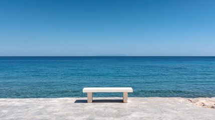 Empty white bench on a waterfront pier. Ocean view.  Possible use for meditation or relaxation
