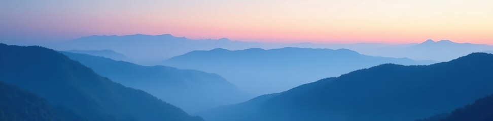 Soft blue mist descends over mountains at dusk, serenity, foggy mountains,