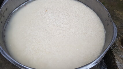 Soaking Rice in a Large Metal Container