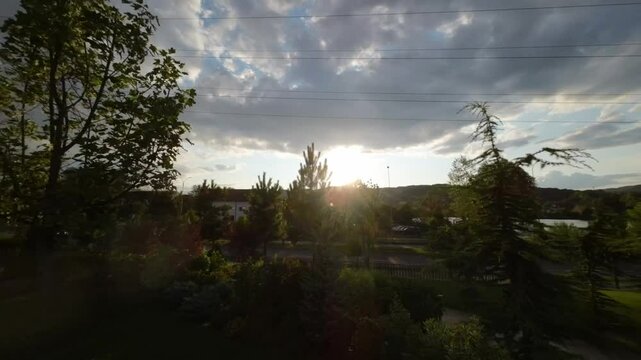 Drone footage of a restaurant garden near Lake Ostroveni in Ramnicu Valcea, Romania at sunset