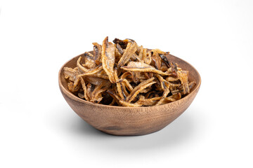 Crispy Fried anchovy natural flavor in a wooden bowl isolated on white background.