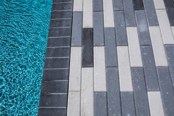 closeup of pool and pavers