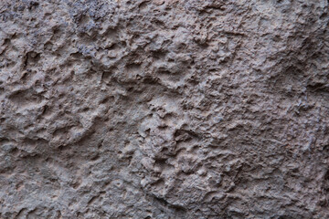 Lava rock wall background, gray pink color