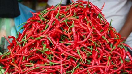 fresh curly rec chilies are sold in traditional markets