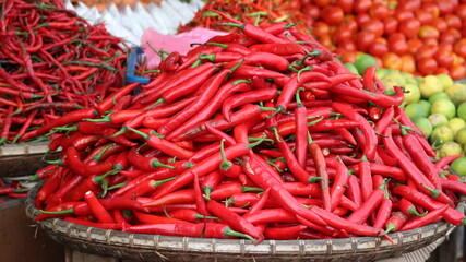 fresh curly rec chilies are sold in traditional markets