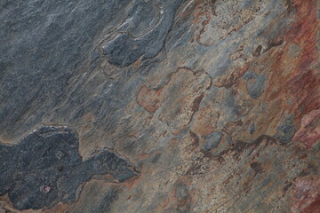 Beautiful slate stone tile natural background texture with gray, blue, orange, brown