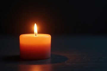 Softly glowing candle flame on dark background, , peaceful ambiance