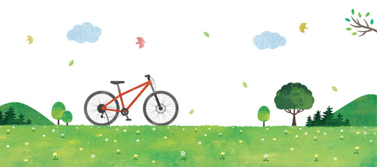 赤い自転車と緑の草原の風景