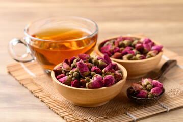 Rose tea in cup glass with dried rose bud, Healthy flower tea