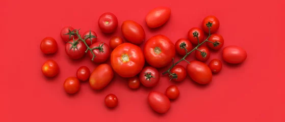  Fresh ripe tomatoes on red background © Pixel-Shot
