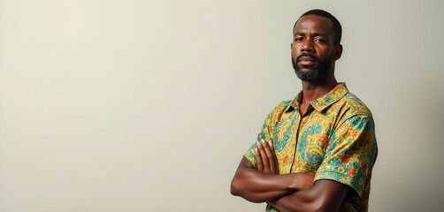 Obraz premium Resentful Caribbean Man in Traditional Brightly Patterned Clothing