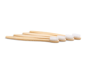 Many bamboo toothbrushes on white background