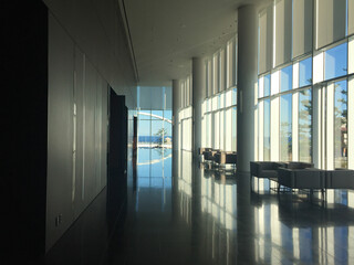A well-designed architectural interior of a spacious lobby that appears upon entering a building.