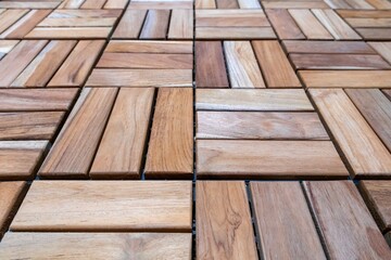 A floor covered with wooden decking tiles