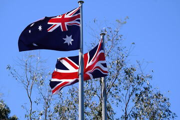 The British Union Jack and Australian flag flying together