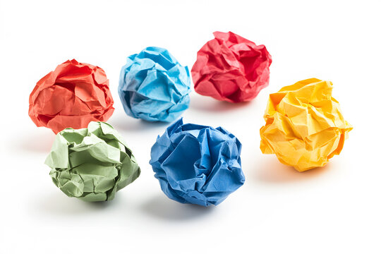 Crumpled sheet cycle balls multicolor blue, orange, pink, yellow, green, red paper against on white background. Image highlights textures and folds of paper, symbol waste, recycling.