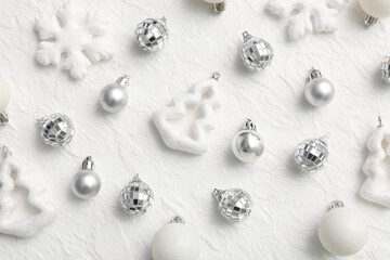 Silver Christmas baubles with snowflakes on white grunge background