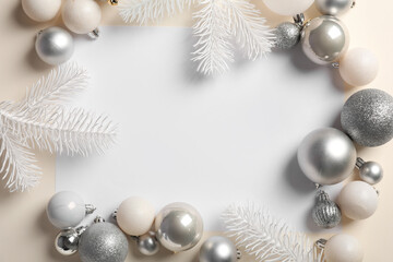 Frame made with blank card, Christmas balls and fir branches on white background