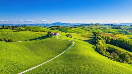 Aerial view of a house in a green rolling landscape