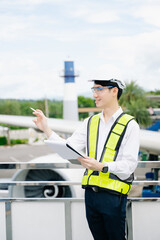 Male aviation engineer in safety gear inspecting an airplane engine, embodying professionalism