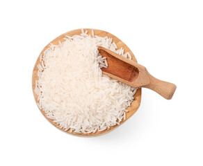 Wooden bowl and scoop with raw rice isolated on white background, top view