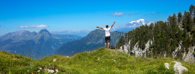 Happy Hiker with Arms Raised on Mountain Summit - Adventure & Travel