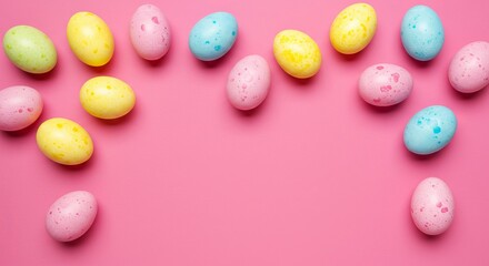 Colorful easter eggs arranged on pink background in festive spring theme