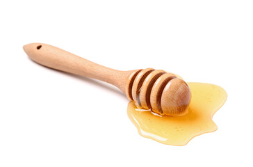 Wooden dipper with spilled honey isolated on white background, closeup