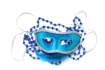 Beautiful blue carnival mask with feather and beads on white background