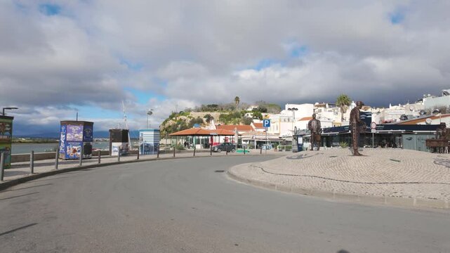 Roundabout with statues representing fishermen, located in the charming fishing village of Alvor, in the Algarve region, southern Portugal