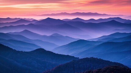 Obraz premium A panoramic view of towering mountains at dusk, with the sky glowing orange and purple --ar 16:9 --v 6 Job ID: fe65f488-d590-4d1f-b8d1-af19c4e84f93