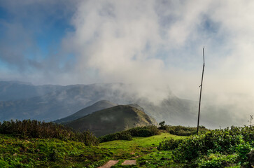 Mountain landscape with clouds at Mullayanagiri Peak in Chikkamagaluru, Karnataka, India
