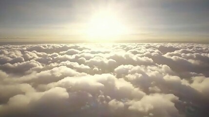 Radiant sunrise over fluffy clouds aerial view nature photography serene environment