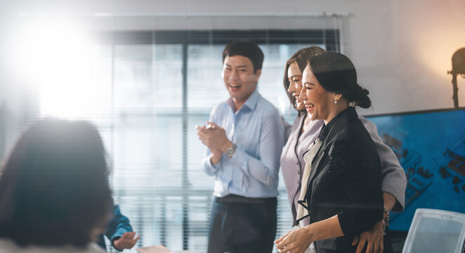 Happy moment group of business asian people money fund success from investor victory deal