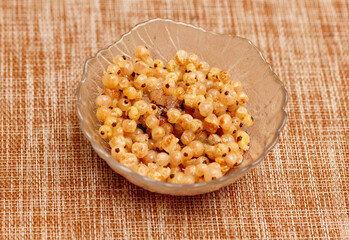 A bowl of food with a lot of small pieces of food in it