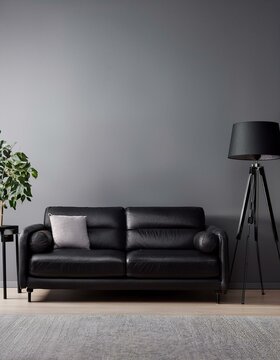 Living room interior with black sofa and empty grey wall