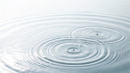 Fototapeta premium Subtle Concentric Water Ripples on White Background in Minimalist Style, Capturing Movement and Flow of Water