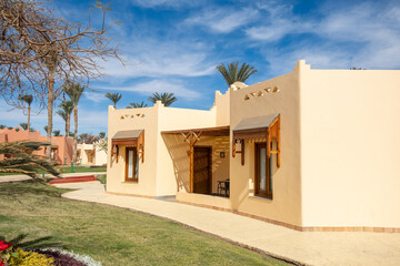 Charming resort accommodations in Egypt with palm trees and blue skies