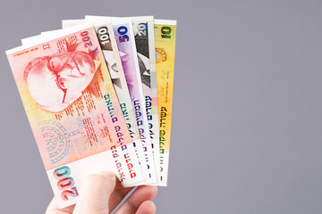 Old Israeli money in hand