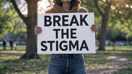 Girl in Park Holding a Poster Saying "Break the Stigma"