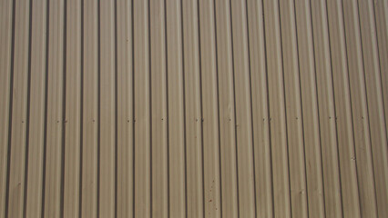 Urban Minimalism. Neutral-toned metal wall with geometric rhythm