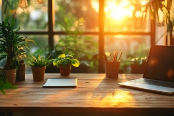 A serene workspace featuring a laptop, notepad, and plants, illuminated by warm, golden sunlight filtering through large windows.