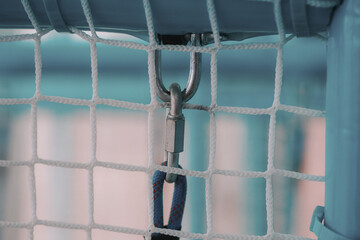 close up of protective nets and carabiners at the playground