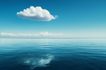 A vast, calm sea under the blue sky, with a white cloud in sky. The water is deep and serene, reflecting the clear sky above it. 